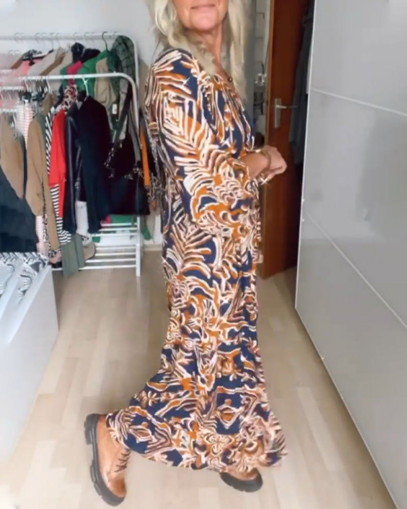 Vestido longo com estampa e decote em V