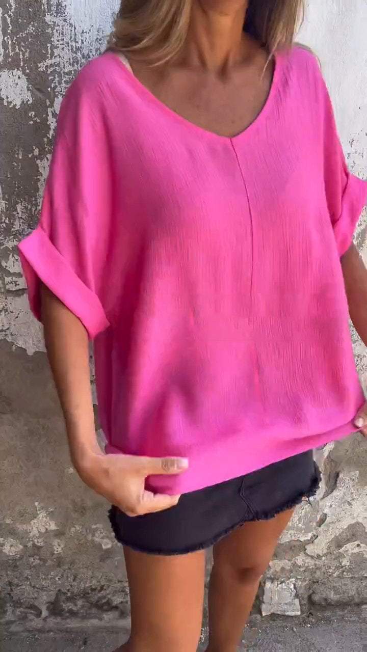 Top casual com mangas médias e decote em V